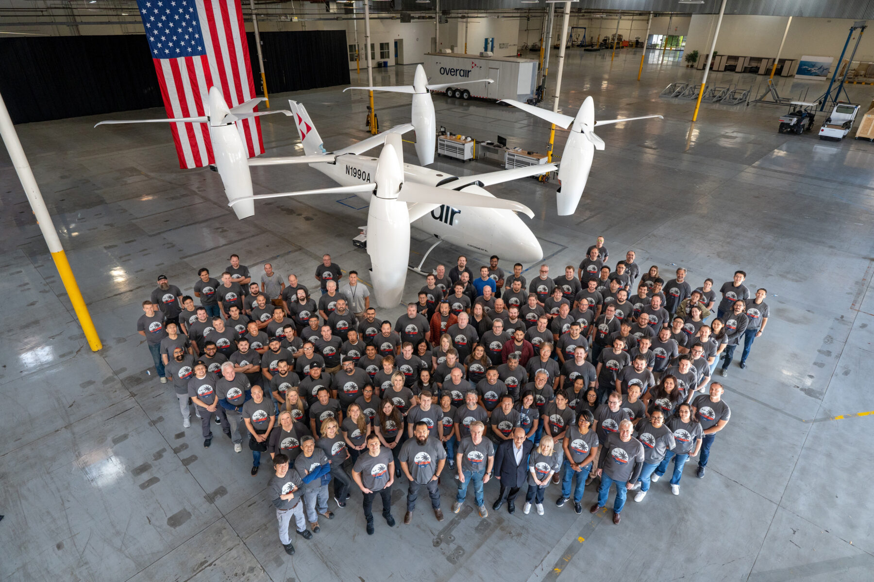 Overair employees in front of prototype